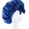 A deep blue silky satin sleep bonnet tied in a bow, displayed on a white mannequin head.