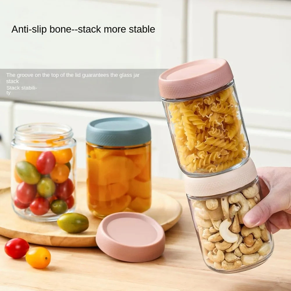 Glass meal prep jars with airtight lids showing various foods like fruit and nuts