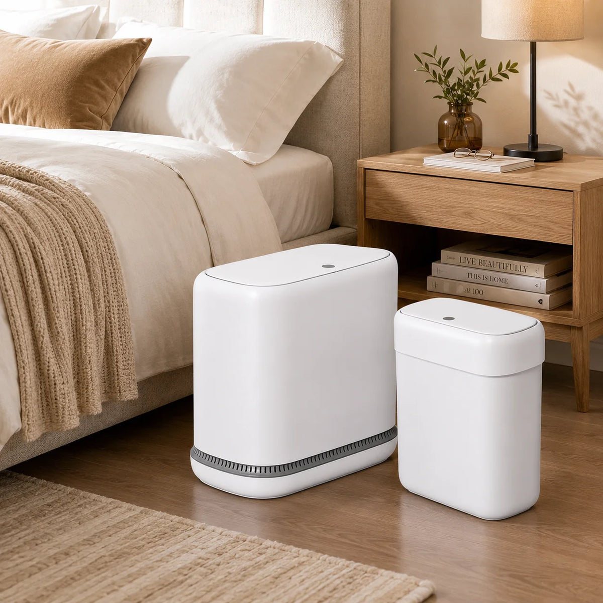 A white slim 2-piece trash can set with lids and a hidden bag design sitting on a wooden floor.
