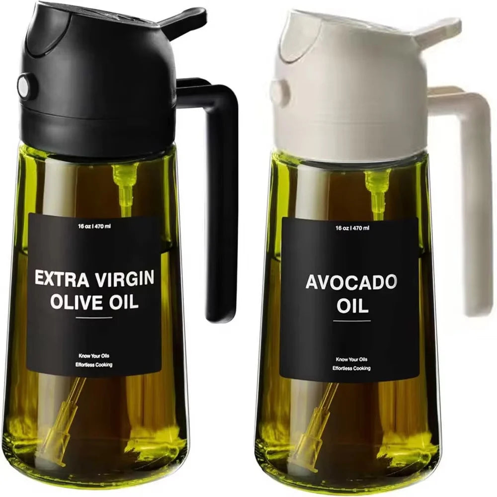A clear glass olive oil dispenser with a black pump and a white avocado oil dispenser.