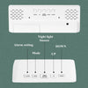 A white digital alarm clock device showing various function buttons including Alarm, Mode, Light Snooze, Up, and Down.