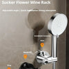A silver No-Drill Adjustable Suction Cup Flower Wine Rack shower head holder installed on a bathroom wall.
