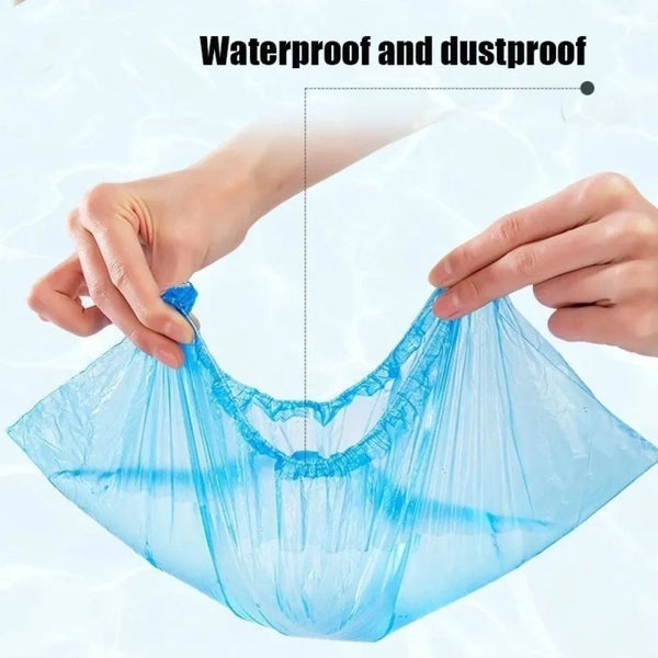 A hand is holding a clear blue waterproof plastic shoe cover, demonstrating its protective qualities.