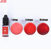 A bottle of red liquid candle dye next to three discs showing 1, 5, and 10 drops of the red color.