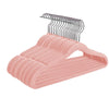 A pink multi-pack of non-slip velvet hangers for children, featuring wire hangers and a plastic hanger bar.