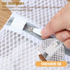 A hand is shown opening a concealed zinc alloy zipper on a white honeycomb mesh laundry bag.