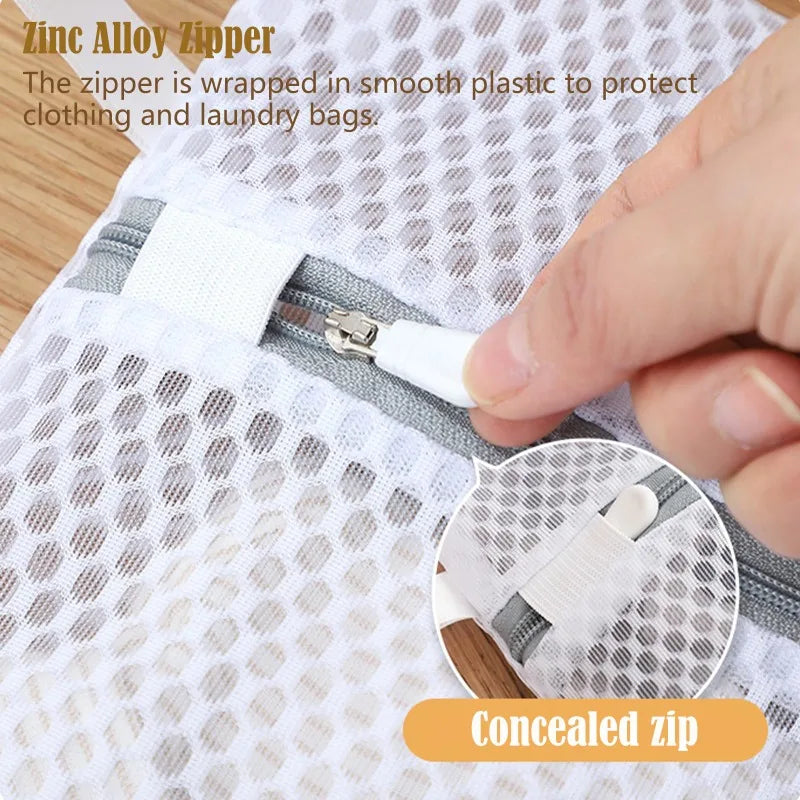 A hand is shown opening a concealed zinc alloy zipper on a white honeycomb mesh laundry bag.