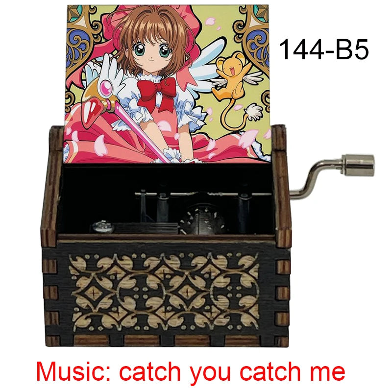 A wooden musical tone box featuring an anime character, labeled 144-B5, with the music title catch you catch me.
