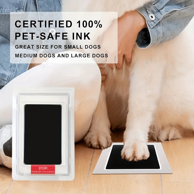 A paw print commemorative ink pad is shown being used by a person with a dog, emphasizing its pet-safe ink features.