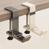 A close-up view of a metal and cream colored adjustable desk hook bag hanger mounted on a wooden desk surface.