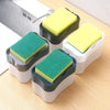 A set of three portable press-type liquid soap dispensers with yellow and green foam applicators on a wooden surface.