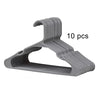 A set of ten gray plastic clothes hangers with curved hooks.