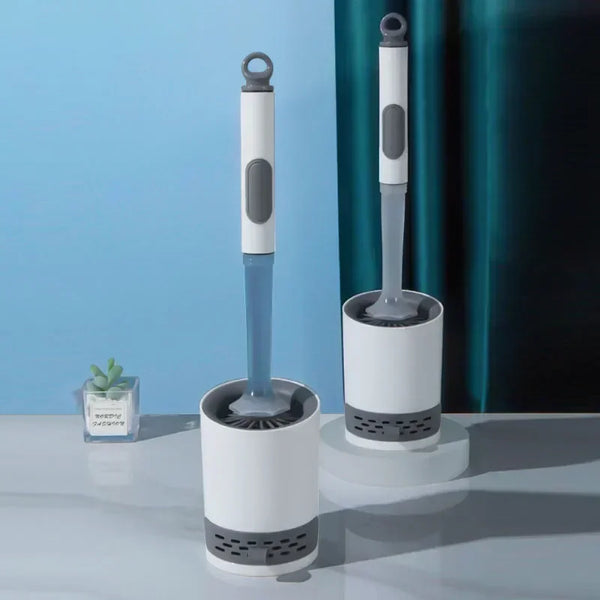 A white and blue refillable wall-mounted silicone toilet brush set displayed on a light surface.