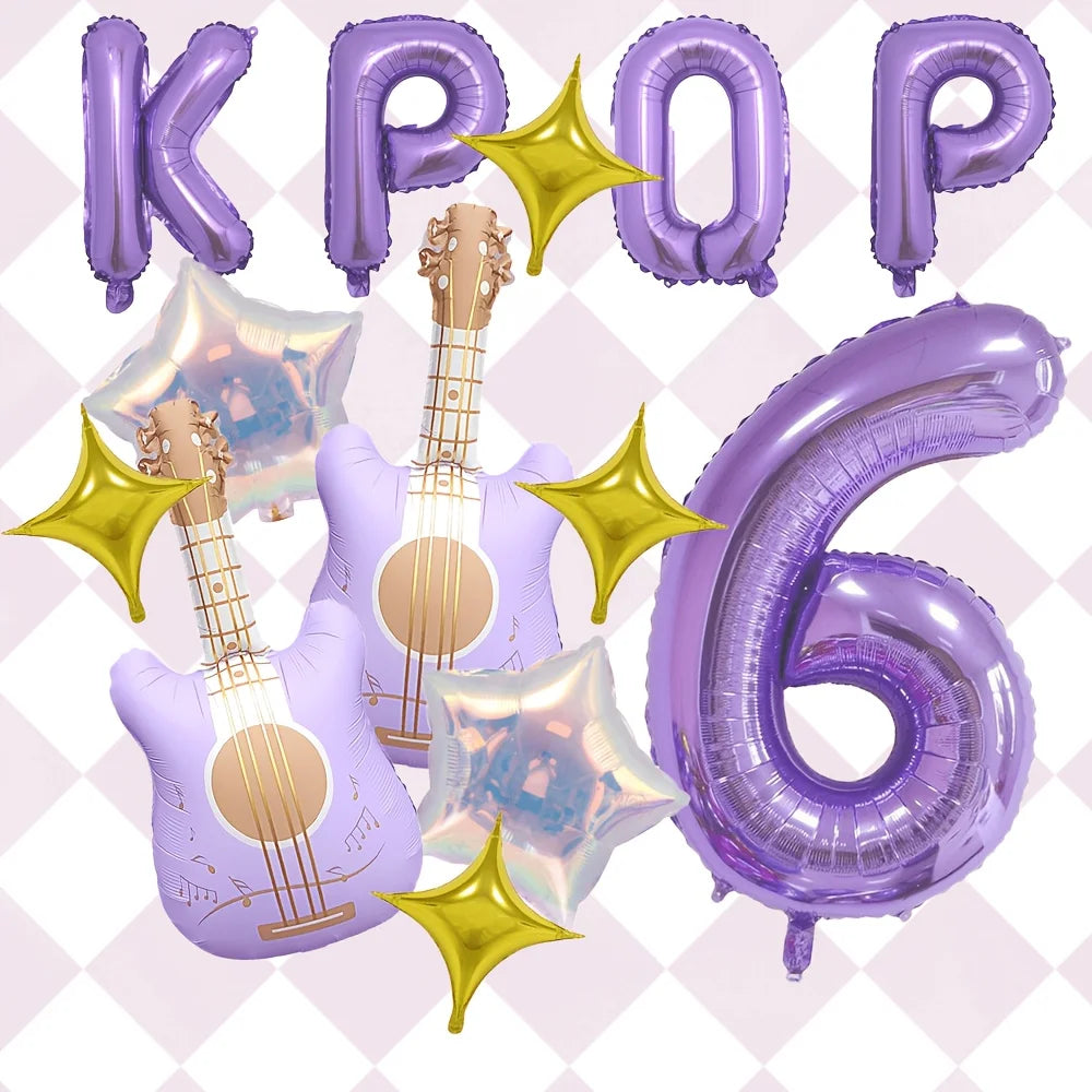 A set of purple balloons shaped like letters and numbers, including the word KPOP and the number 6, with golden star accents.