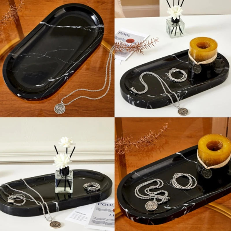 A set of black marble silicone trays and silver chains used as a kitchen and bathroom organizer.