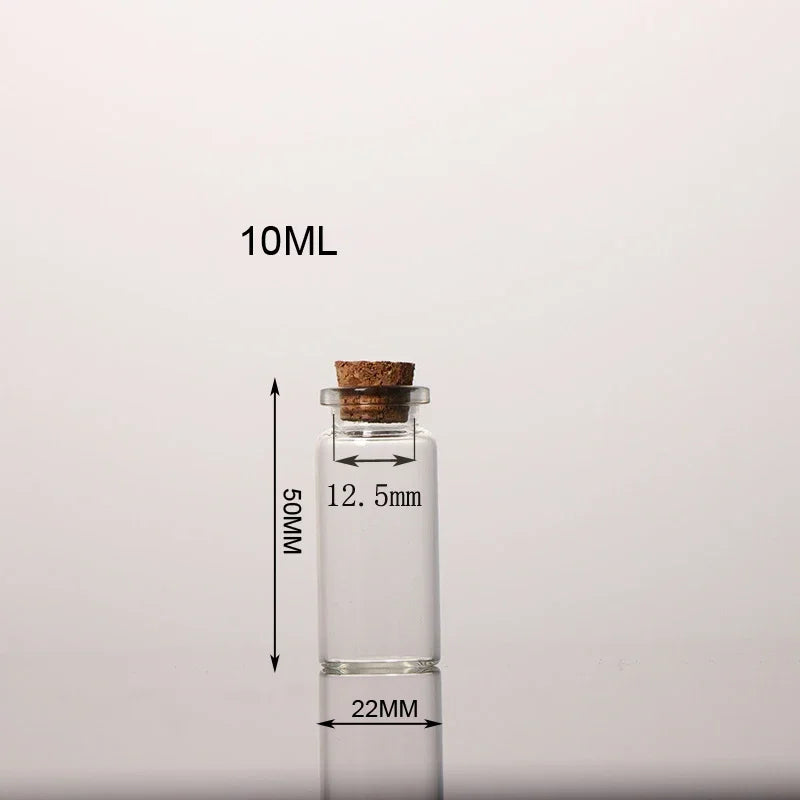 Flacon en verre transparent avec bouchon de liège, étiqueté 10ML et mesurant 50MM de hauteur.