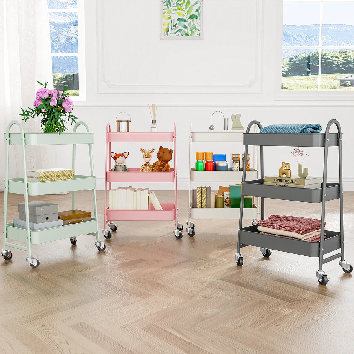 A pink and gray metal rolling storage cart with three tiers is shown in a bright room.