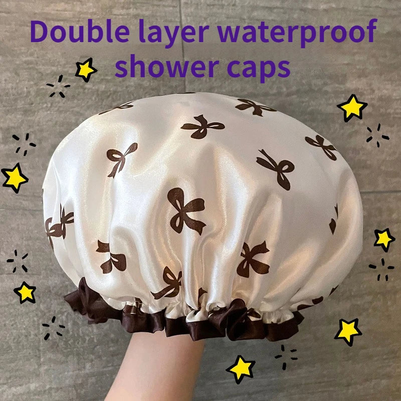 A white satin double layer waterproof shower cap with brown bow patterns