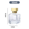 A clear glass perfume spray bottle with a gold cap and a 50ml volume marker.