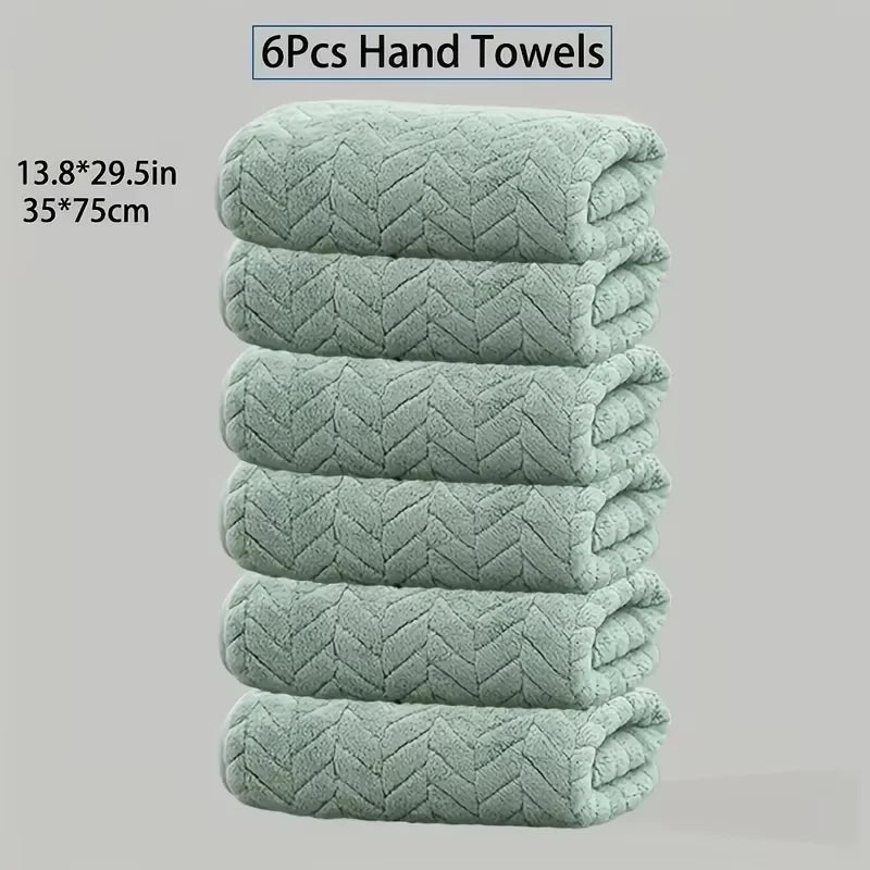 A stack of six light green textured hand towels, measuring 13.8x29.5 inches each.