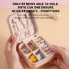 A pink portable PU leather jewelry storage box is shown open, displaying various pieces of jewelry and accessories.