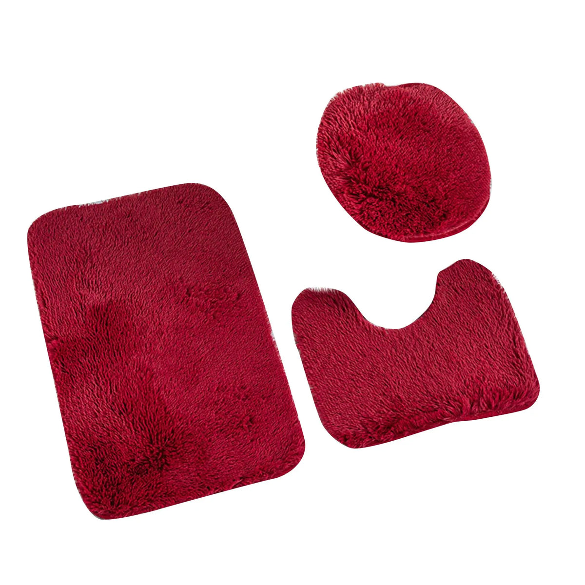 A set of three deep red, fluffy non-slip bathroom rugs.