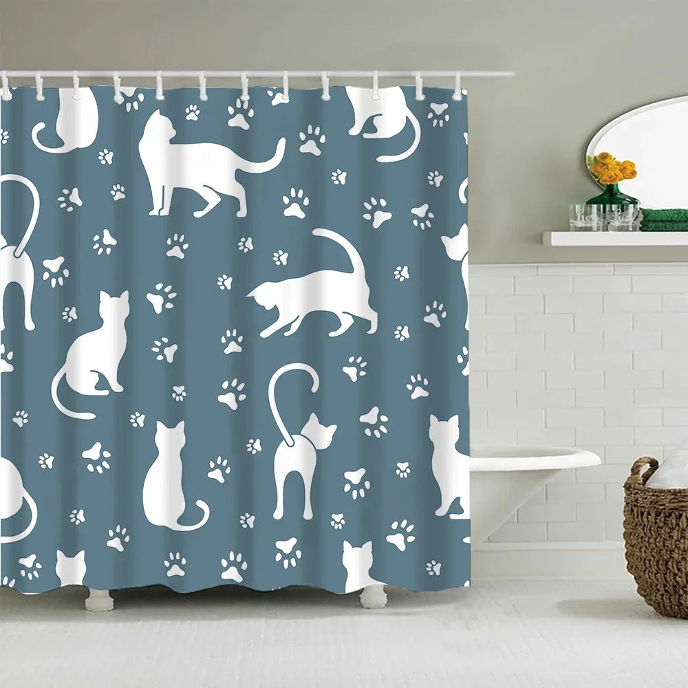 A white and gray cartoon cat pattern shower curtain featuring various feline silhouettes and paw prints.