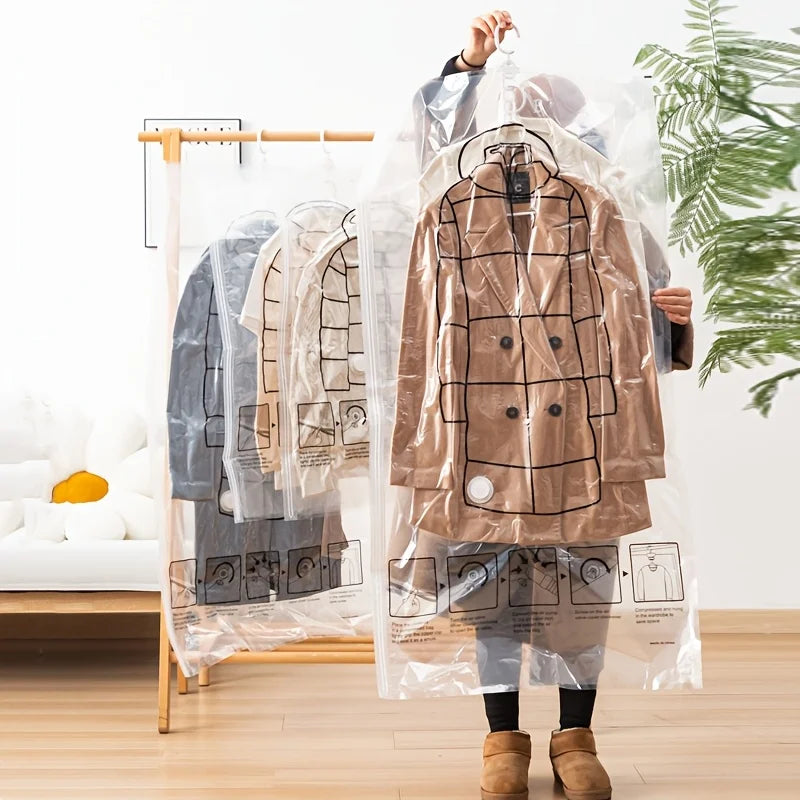 A person is hanging a brown jacket inside a clear vacuum storage bag on a wooden rack.
