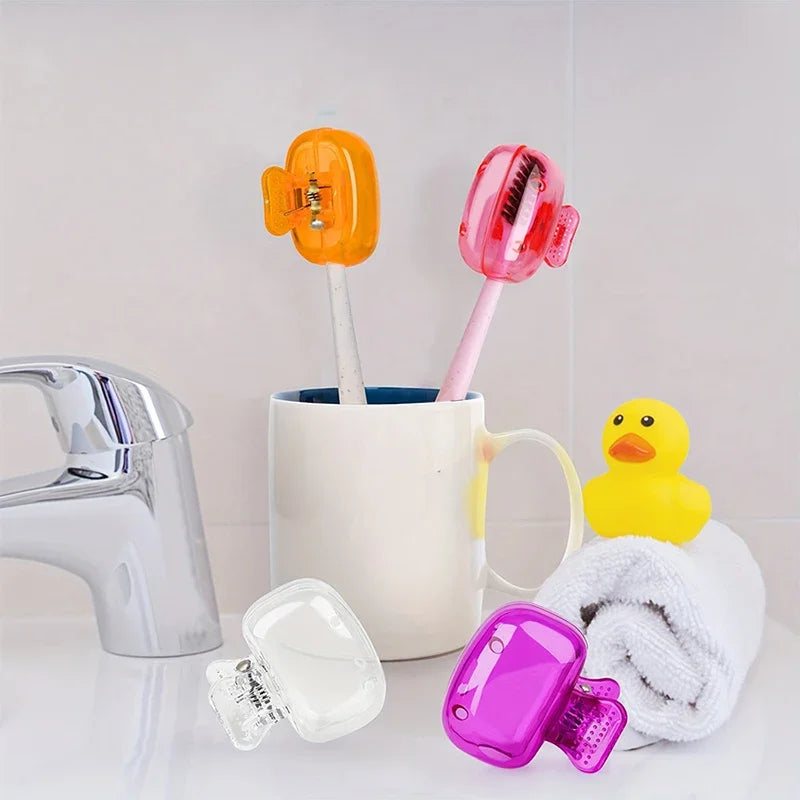 A collection of colorful protective caps for toothbrush holders, including orange and pink silicone covers.