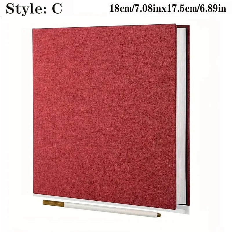Rotes Leinen-Fotobuch mit Selbstklebefolie, weißer Einband.
