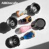 Una colección de portafiltros de café desnudos de varios colores para máquinas de espresso, mostrados sobre un fondo blanco.