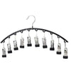 Curved metal hangers with ten clips used for clothing organization.