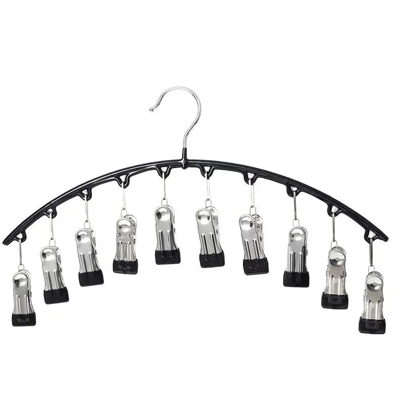Curved metal hangers with ten clips used for clothing organization.