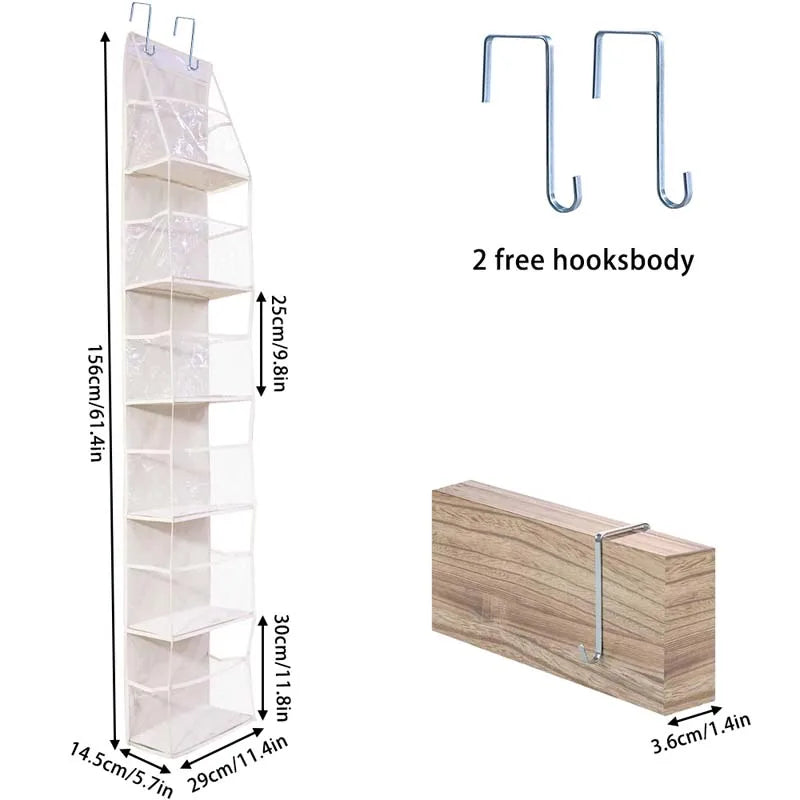 A tall, white fabric storage organizer with multiple pockets and two free hooks.