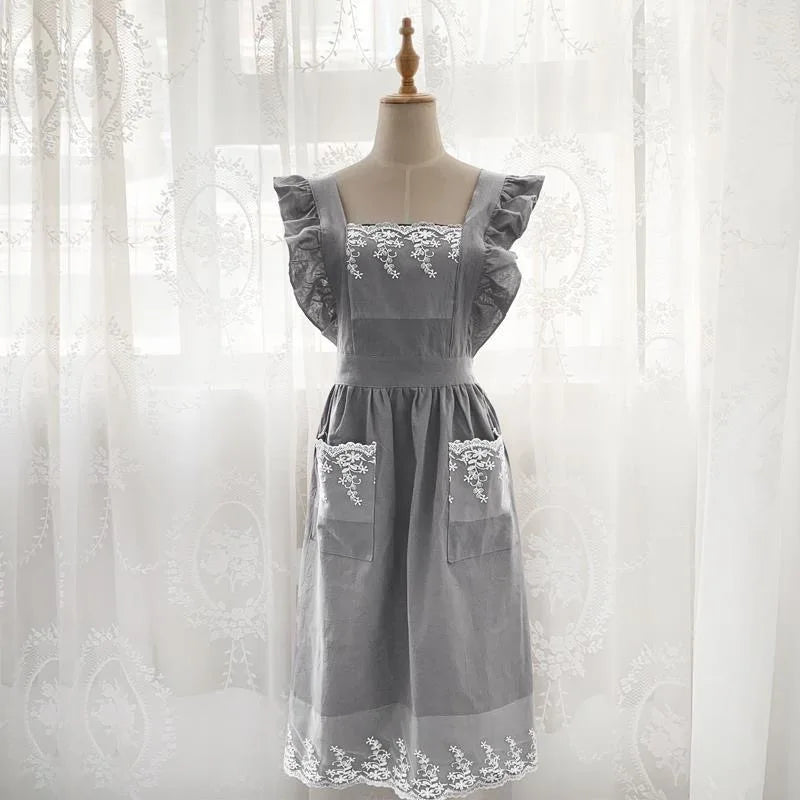 Gray cotton linen kitchen apron with lace detail displayed on a mannequin.