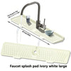 Large ivory white silicone faucet splash guard mat with a metal faucet shown in use.