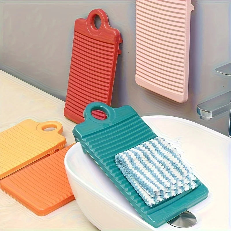 A set of colorful portable anti-slip wash basins and mats displayed on a white surface.