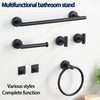 A black multifunctional bathroom stand with a towel bar and ring holder mounted on a white wall.