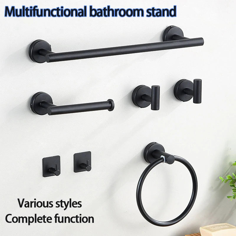 A black multifunctional bathroom stand with a towel bar and ring holder mounted on a white wall.