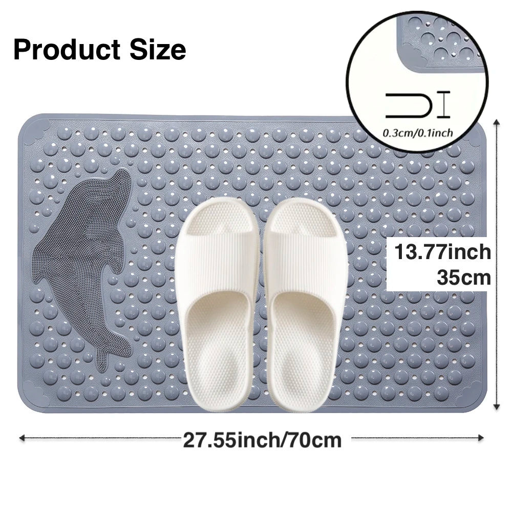 A gray rectangular non-slip bath mat with a dolphin shape molded into the surface and two white flip-flops displayed on it.