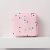 Pink floral nylon sanitary pad storage pouch with white and green flower patterns