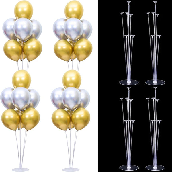 A display of gold and silver balloons on clear plastic stands.