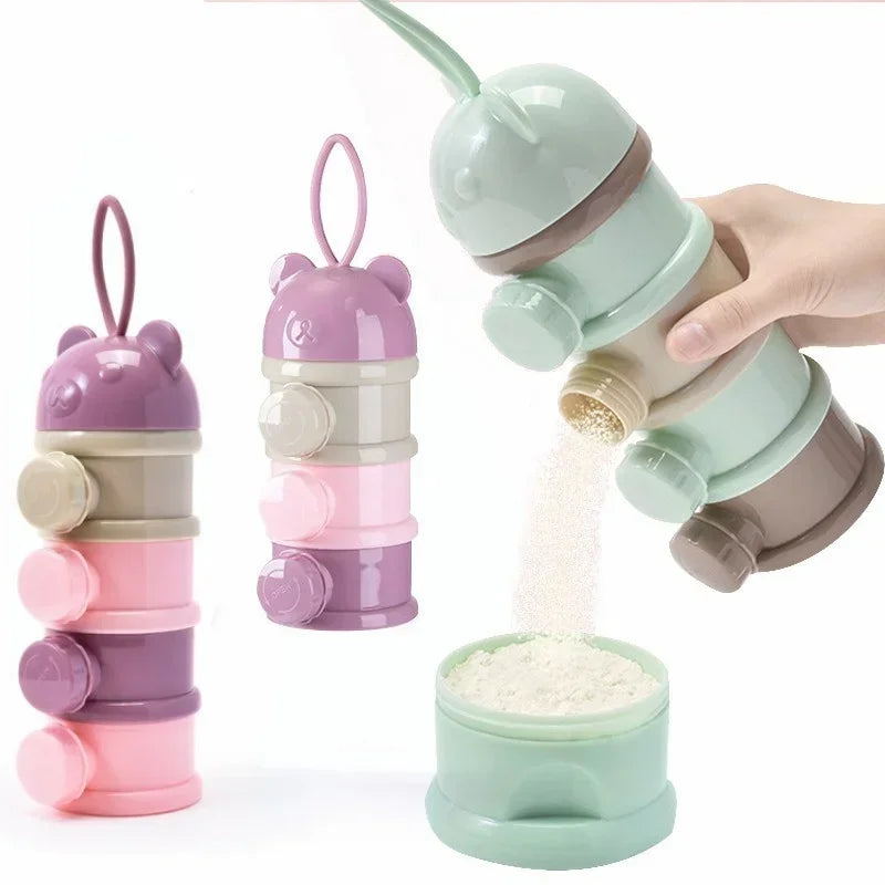 A hand is holding a stack of layered silicone food storage boxes in various shades of purple and green, with some powder spil
