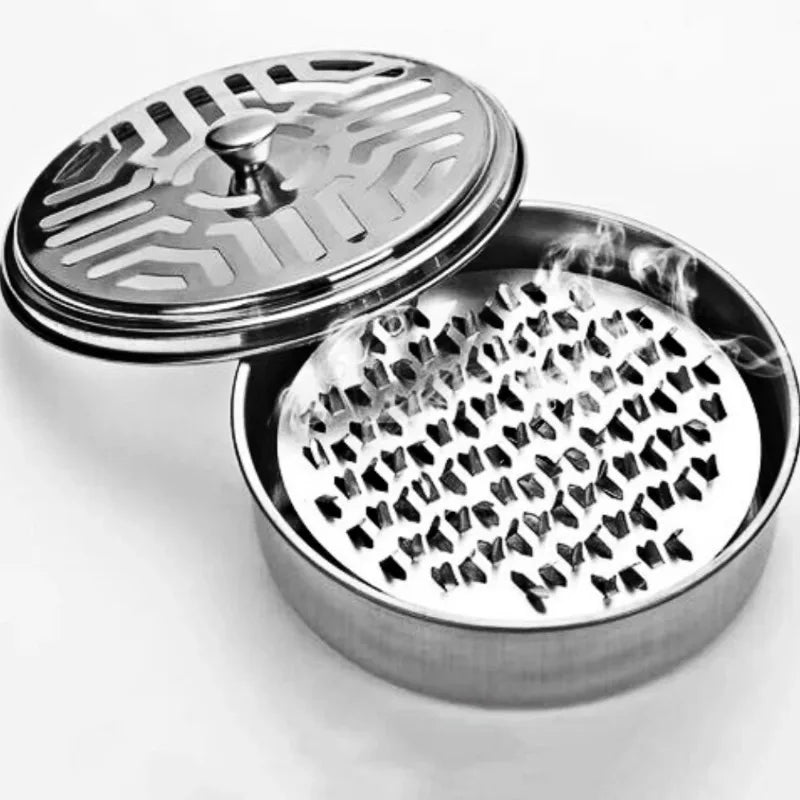 A stainless steel mosquito coil tray holder with a lid, showing the perforated base for holding coils.