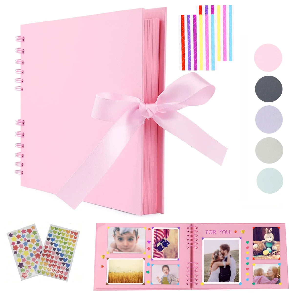 Cuaderno espiral rosa con cinta rosa e inserts de papel decorativos para álbum de scrapbooking.