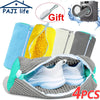 Four reusable grey shoe cleaning bags filled with yellow and white cleaning brushes