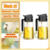 Black plastic oil spray bottle with a pump mechanism shown in two views.