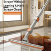 A silver double-sided window cleaning tool is shown being used to clean a glossy floor.
