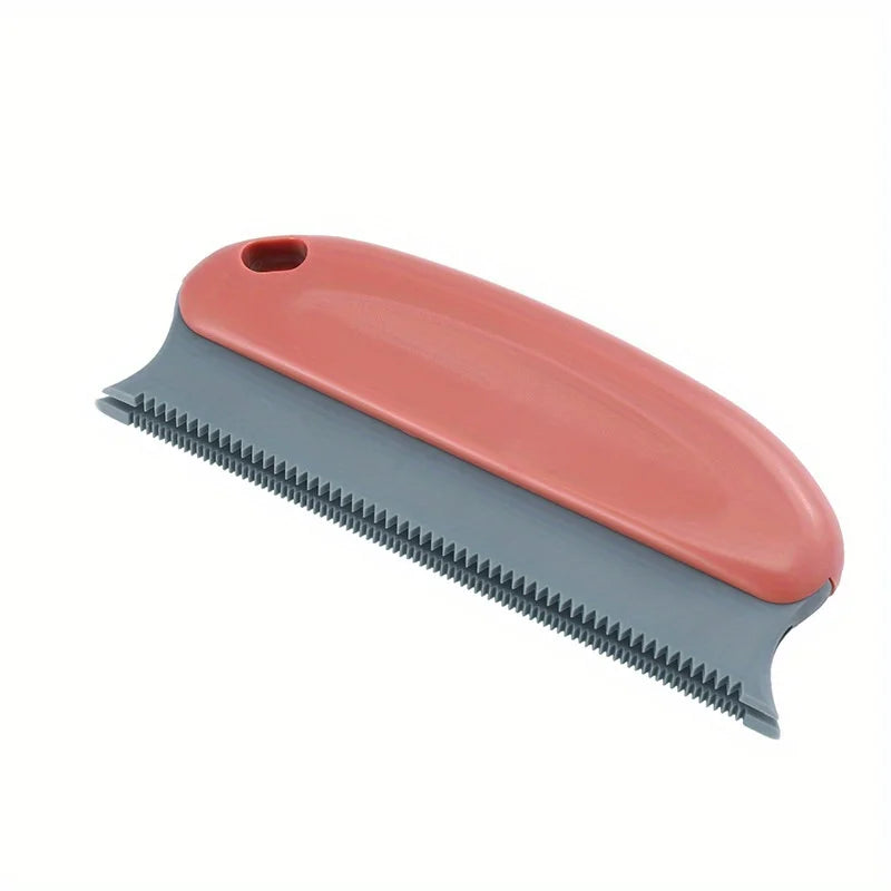 A pink and gray pet hair remover brush for cats and dogs shown from the side.