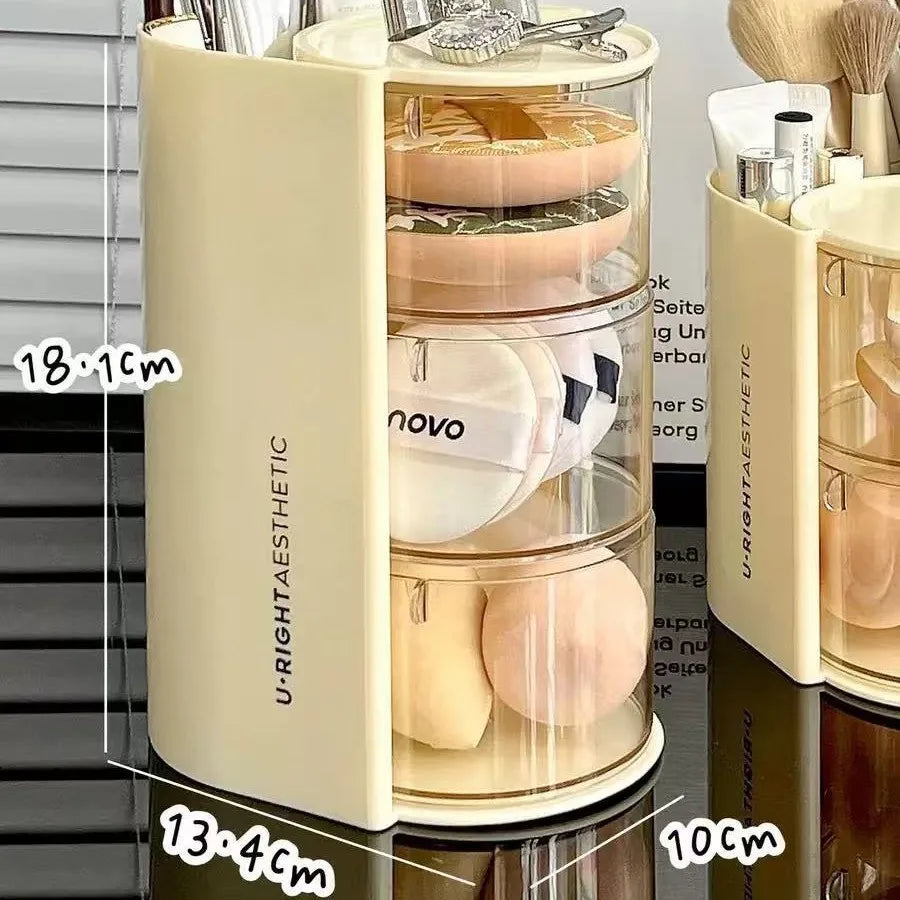 A beige acrylic rotating organizer for hair accessories and makeup, showing various tools and items inside.